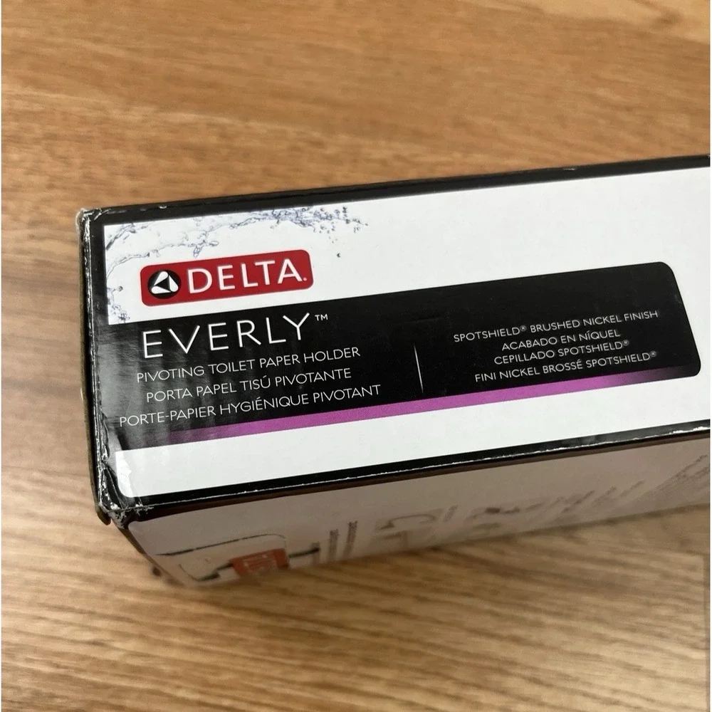 Delta Everly Wall Mount Pivot Arm Toilet Paper Holder Brushed Nickel NEW